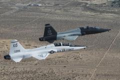 T-38 A-model and T-38 C-model are flown in formation one last time at Edwards Air Force Base, Calif., Sept. 19, 2013. (U.S. Air Force courtesty photo/Bobbi Zapka)