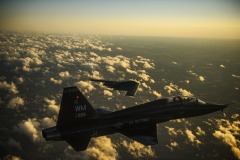 A U.S. Air Force T-38 Talon aircraft and B-2 Spirit aircraft fly in formation during a training mission over Whiteman Air Force Base, Mo., Feb. 20, 2014. The B-2 is a multi-role bomber capable of delivering both conventional and nuclear ammunition. (DoD photo by Staff Sgt. Jonathan Snyder, U.S. Air Force/Released)